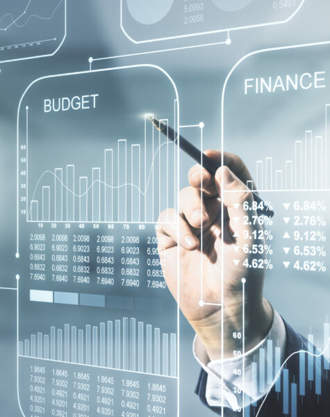 Multi exposure of male hand with pen working with abstract statistics data hologram interface on blurred office background, computing and analytics concept
